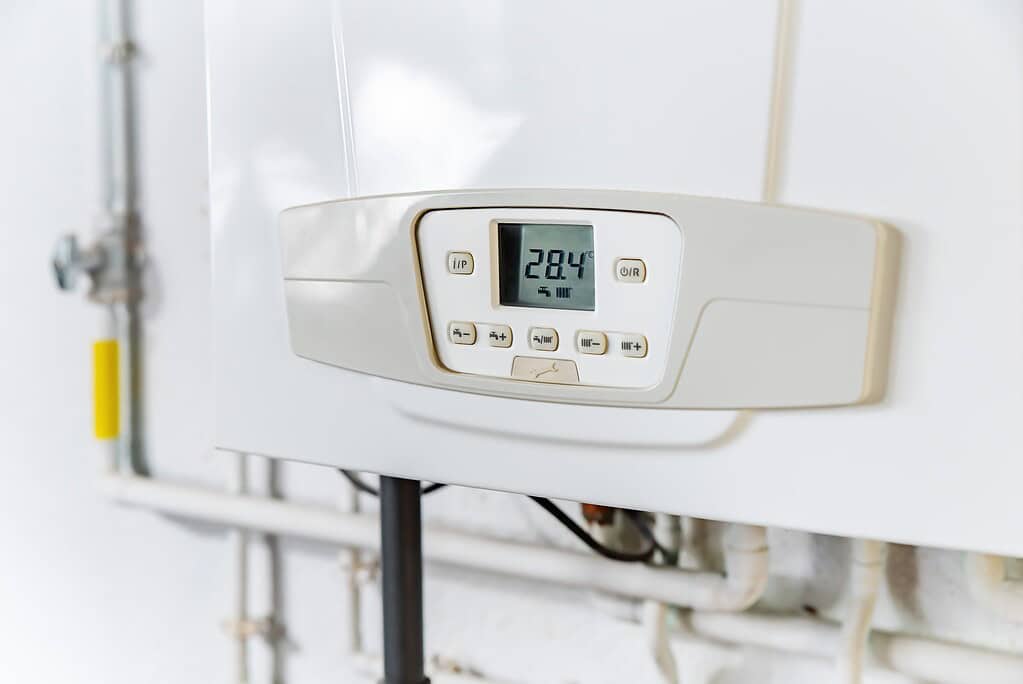 Close-up view of a modern domestic boiler unit showing controls and casing.